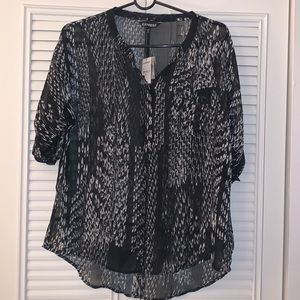 Black and white sheer blouse with rolled cuffed sleeves